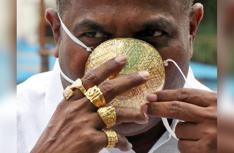 Businessman spare no expense to don pure gold face mask