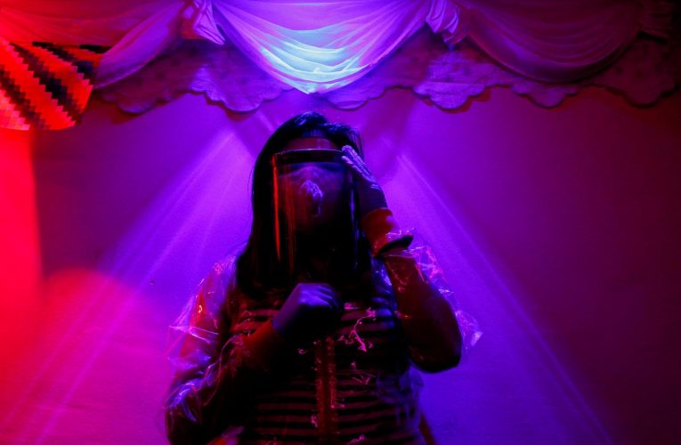 Bolivia sex workers are donning see-through raincoats to keep Covid-19 at bay