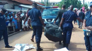 Nigerian police carrying the corpse of the man who died during sex marathon. (PulseGhana)