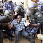 Incest: Uganda police arresting a man during a past protest. (Al jazeera)