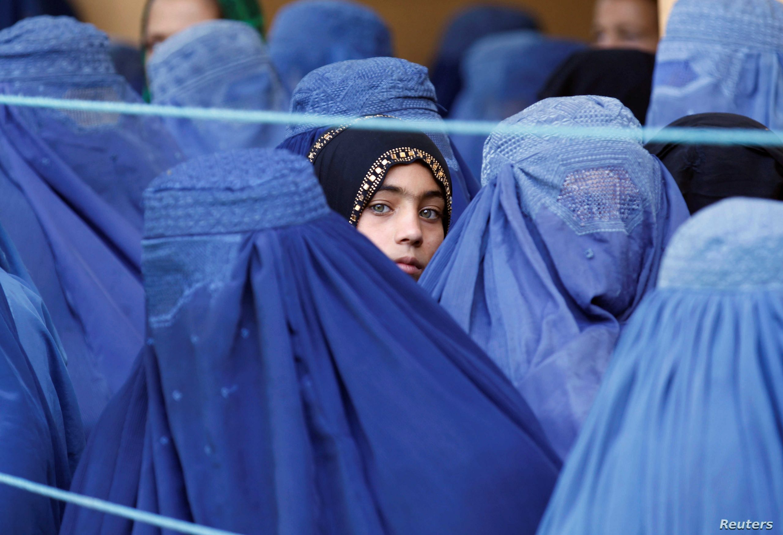Ugandan men eagerly awaiting for Afghan refugee girls fleeing Taliban. (VOA)