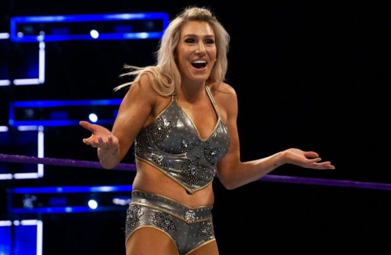 Watch the moment WWE Charlotte Flair suffers wardrobe malfunction and her boobs poops out to all and sundry during Wrestlemania 38